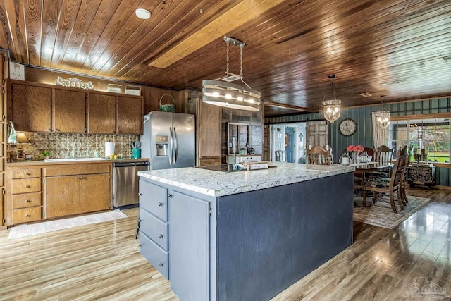 110 Glover Rd, Century, FL 32535 - kitchen with appliances with stainless steel finishes, wood ceiling, a sink, light wood-style floors, and tasteful backsplash