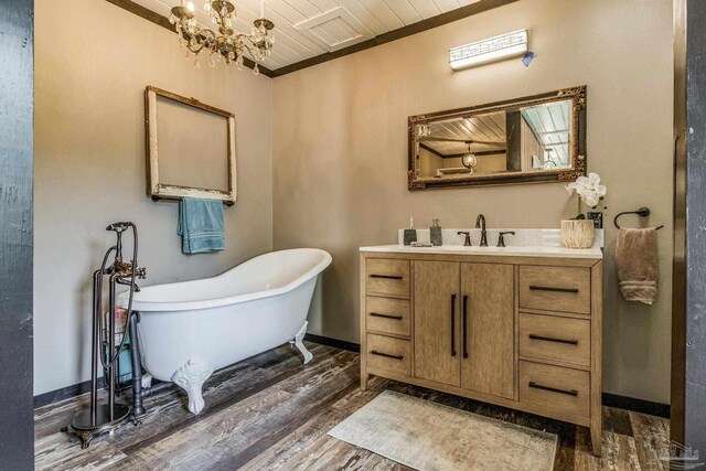 bathroom featuring a bathtub, wood ceiling, vanity, a chandelier, and hardwood / wood-style floors