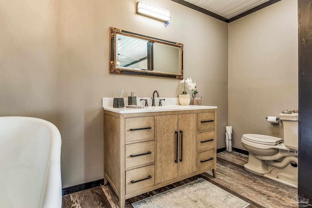 bathroom featuring vanity, wooden ceiling, crown molding, hardwood / wood-style flooring, and toilet