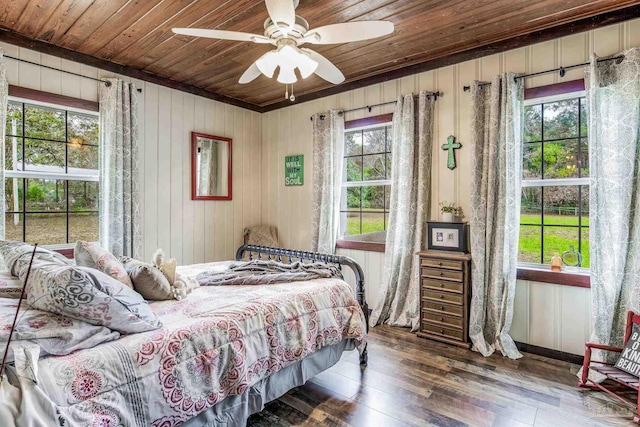 110 Glover Rd, Century, FL 32535 - bedroom with wood ceiling, hardwood / wood-style floors, wooden walls, and ceiling fan
