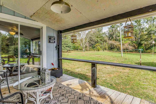 110 Glover Rd, Century, FL 32535 - sunroom with vaulted ceiling, plenty of natural light, and view of scattered trees