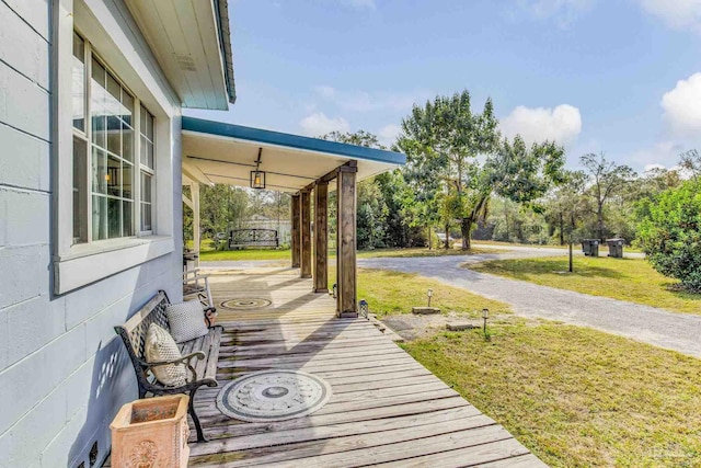 110 Glover Rd, Century, FL 32535 - wooden deck featuring a lawn