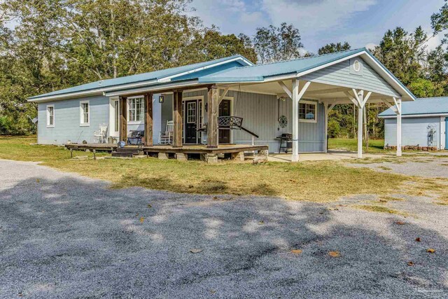 ranch-style home featuring covered porch