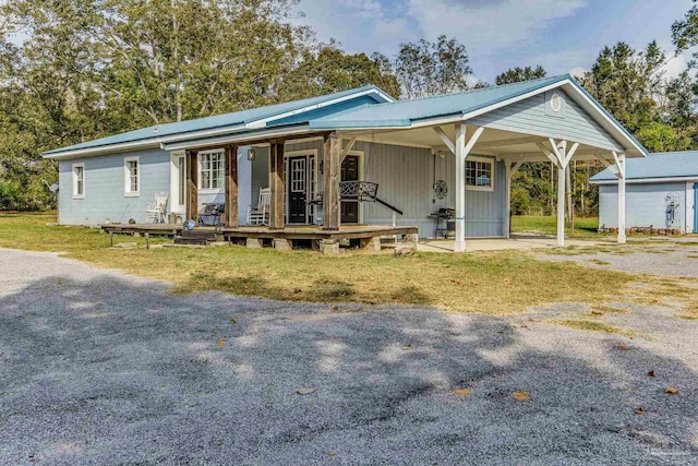 110 Glover Rd, Century, FL 32535 - view of front of home with a porch and a carport