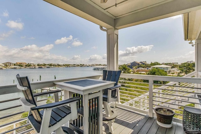 wooden deck featuring a water view