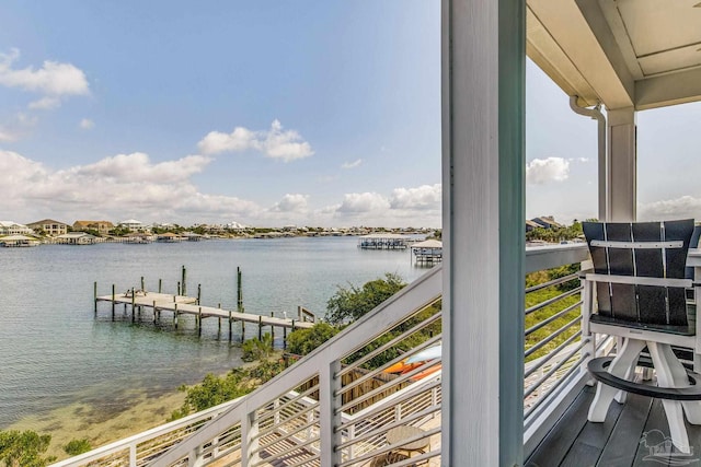 balcony featuring a dock and a water view