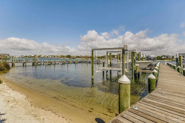 dock area featuring a water view and boat lift