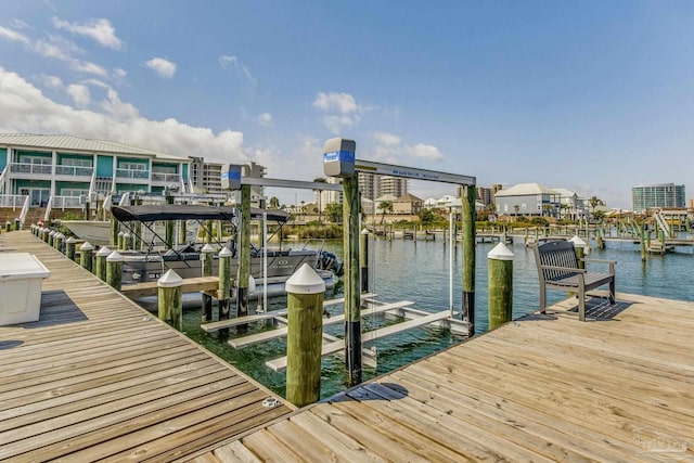 view of dock featuring a water view and boat lift