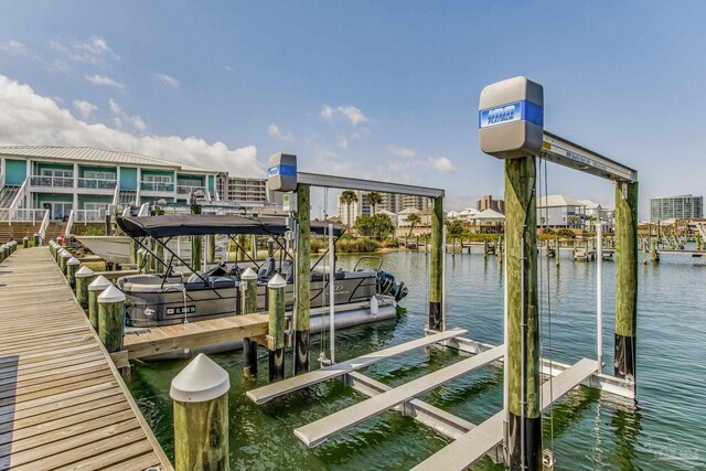 view of dock with a water view and boat lift