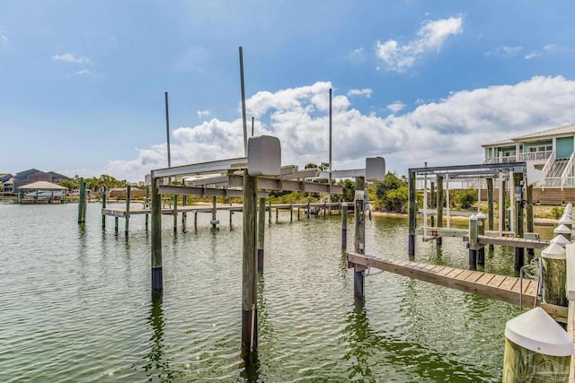 dock area featuring a water view and boat lift