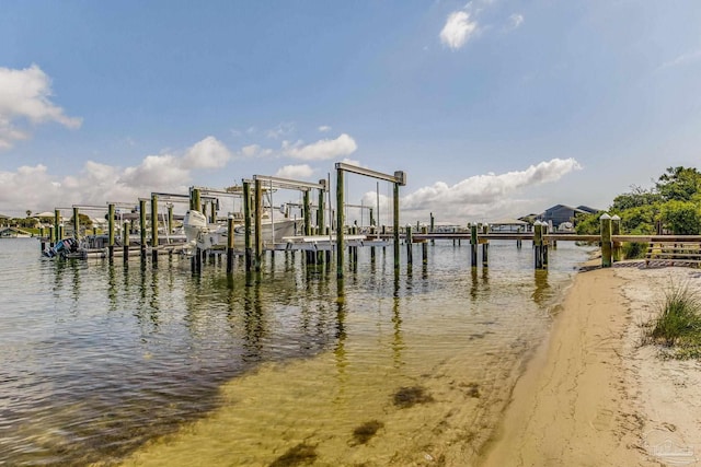 dock area with a water view and boat lift