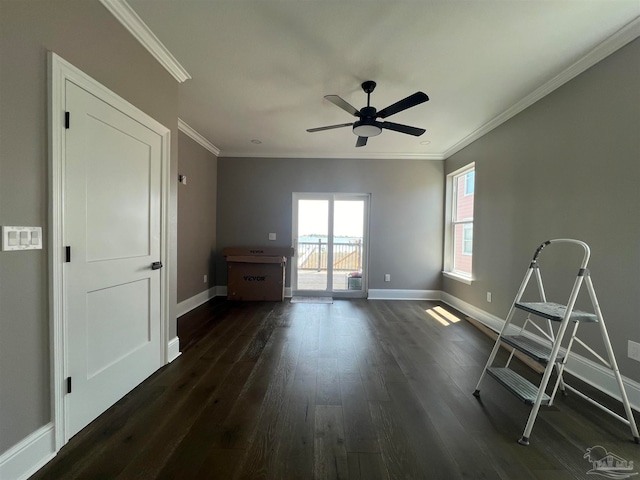 spare room with dark hardwood / wood-style floors, ceiling fan, and ornamental molding