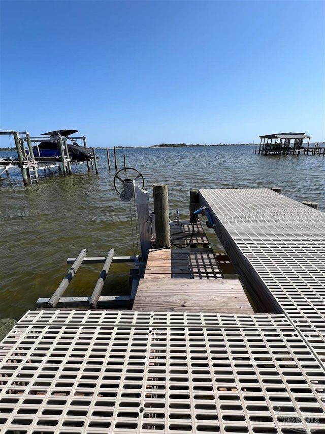 dock area featuring a water view