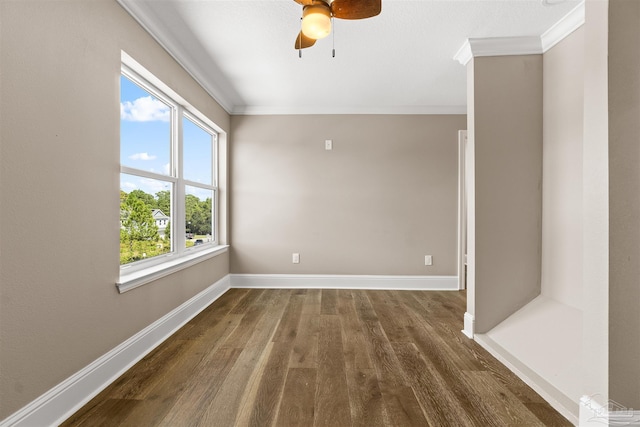 unfurnished room featuring crown molding, ceiling fan, and dark hardwood / wood-style floors