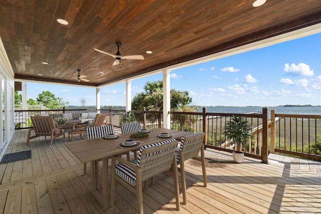 wooden terrace with outdoor lounge area, outdoor dining area, and a ceiling fan