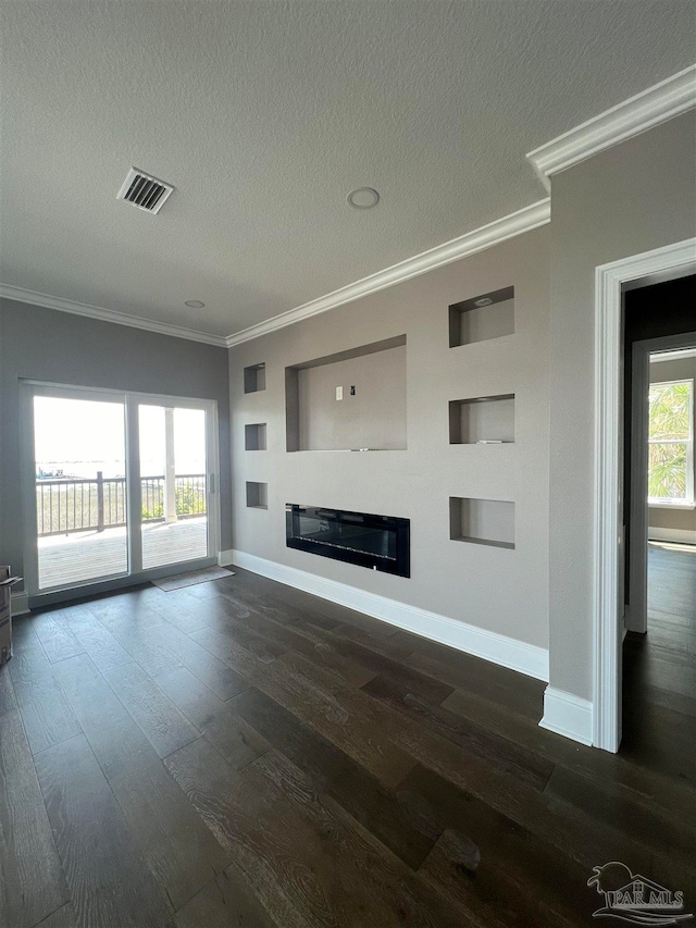 unfurnished living room featuring crown molding, dark hardwood / wood-style flooring, and a textured ceiling