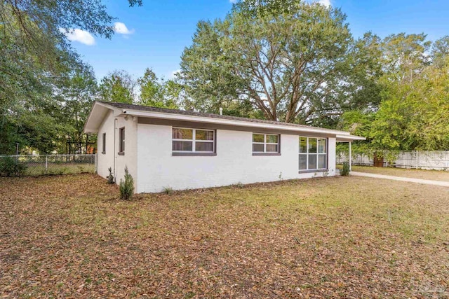 ranch-style house with a front lawn