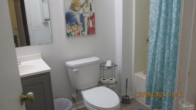 full bathroom featuring vanity, shower / bathtub combination with curtain, and toilet