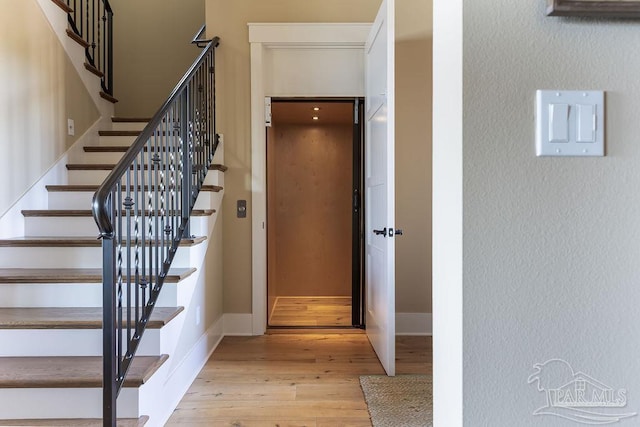 106 Matamoros Dr, Pensacola Beach, FL 32561 - staircase with baseboards and wood finished floors