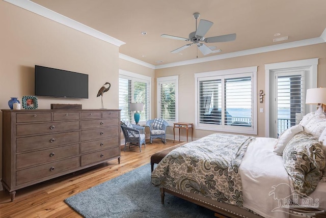 106 Matamoros Dr, Pensacola Beach, FL 32561 - bedroom with access to exterior, crown molding, light wood-type flooring, baseboards, and ceiling fan