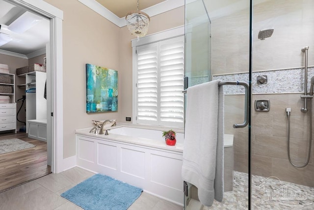 106 Matamoros Dr, Pensacola Beach, FL 32561 - bathroom with a shower stall, a notable chandelier, crown molding, and tile patterned flooring