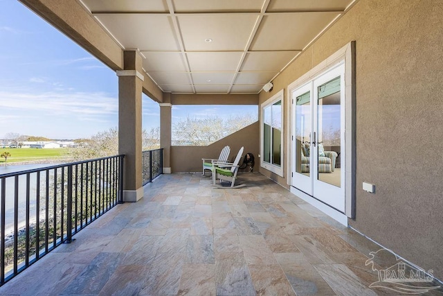 106 Matamoros Dr, Pensacola Beach, FL 32561 - balcony featuring a water view and french doors