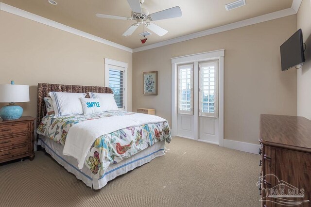 106 Matamoros Dr, Pensacola Beach, FL 32561 - bedroom with baseboards, carpet flooring, visible vents, and crown molding