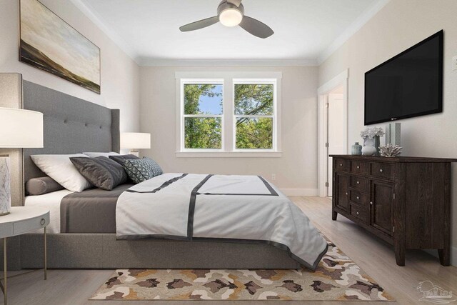 bedroom featuring light hardwood / wood-style floors, ornamental molding, and ceiling fan