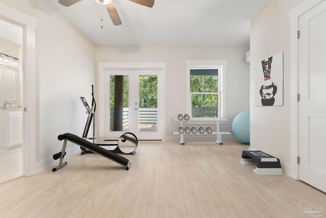 exercise area featuring sink, light hardwood / wood-style flooring, and ceiling fan