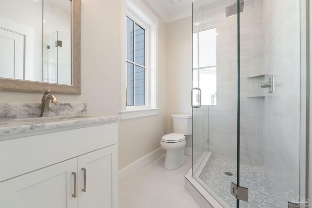 bathroom featuring a shower with shower door, tile patterned floors, toilet, and vanity