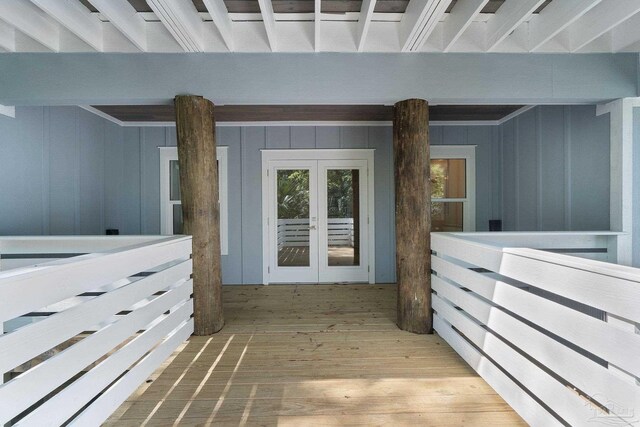 interior space featuring french doors and hardwood / wood-style flooring