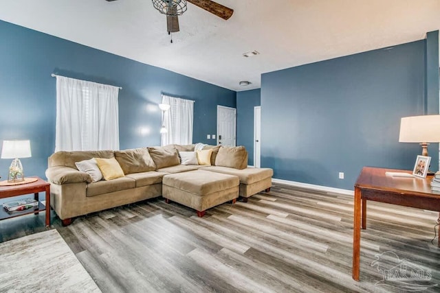 living room with hardwood / wood-style floors and ceiling fan