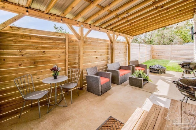 view of patio with an outdoor fire pit