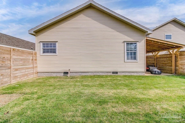 view of home's exterior with a yard