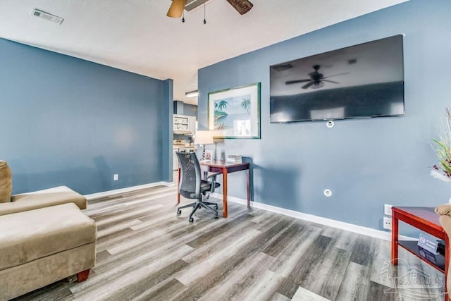 office space featuring hardwood / wood-style flooring and ceiling fan