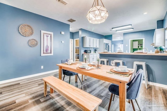 dining area featuring light hardwood / wood-style floors