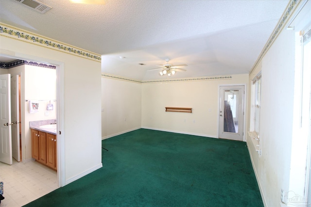 1701 Lighthouse Pointe Dr, Gulf Breeze, FL 32563 - unfurnished room with a ceiling fan, vaulted ceiling, light carpet, baseboards, and a sink