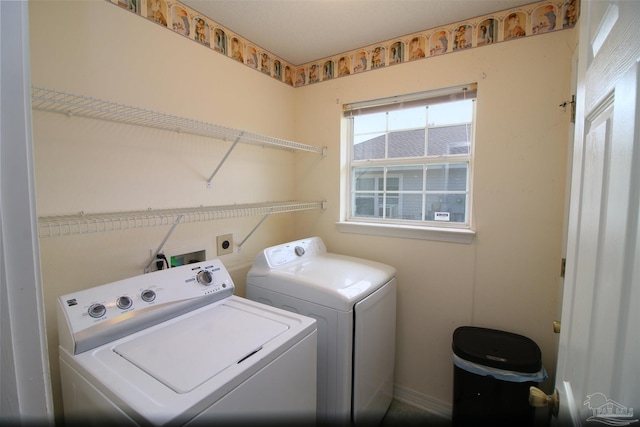 1701 Lighthouse Pointe Dr, Gulf Breeze, FL 32563 - laundry room featuring washer and dryer and baseboards