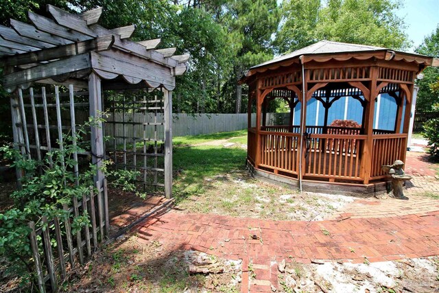 1701 Lighthouse Pointe Dr, Gulf Breeze, FL 32563 - view of yard with a gazebo, a pergola, and a deck