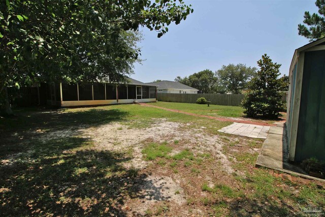 1701 Lighthouse Pointe Dr, Gulf Breeze, FL 32563 - view of yard featuring a sunroom