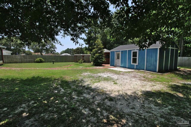 1701 Lighthouse Pointe Dr, Gulf Breeze, FL 32563 - view of yard with an outdoor structure