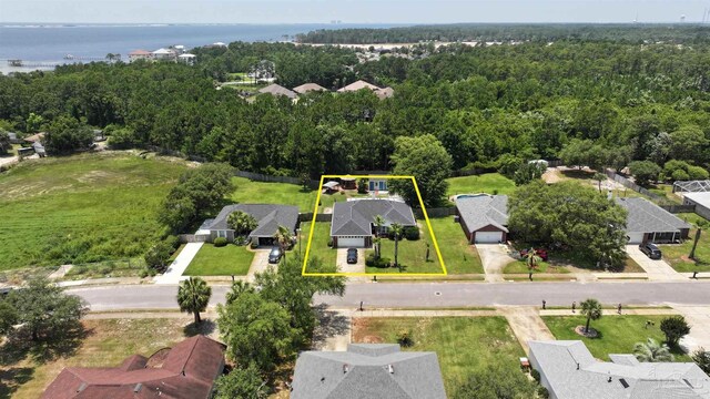 1701 Lighthouse Pointe Dr, Gulf Breeze, FL 32563 - aerial view of residential area with property parcel outlined and a forest
