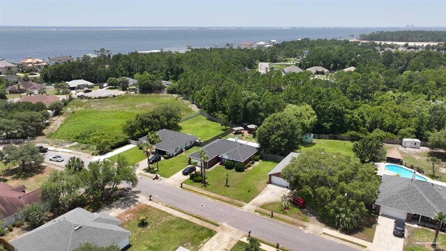 1701 Lighthouse Pointe Dr, Gulf Breeze, FL 32563 - aerial view of property and surrounding area with a nearby body of water, a pool area, and nearby suburban area