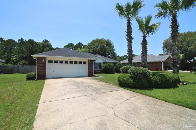 1701 Lighthouse Pointe Dr, Gulf Breeze, FL 32563 - ranch-style home featuring concrete driveway, brick siding, and a garage