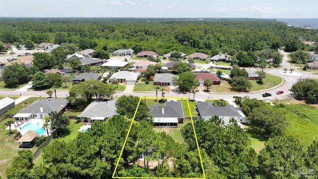1701 Lighthouse Pointe Dr, Gulf Breeze, FL 32563 - aerial perspective of suburban area with a forest, property parcel outlined, and a pool