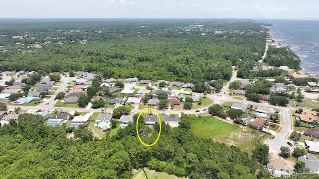 1701 Lighthouse Pointe Dr, Gulf Breeze, FL 32563 - aerial view of property and surrounding area featuring a heavily wooded area and nearby suburban area