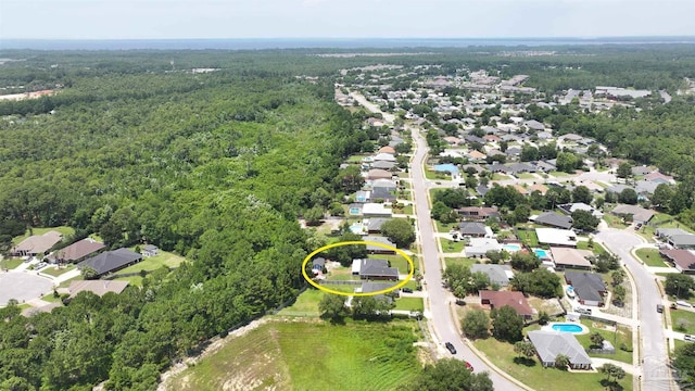 1701 Lighthouse Pointe Dr, Gulf Breeze, FL 32563 - aerial perspective of suburban area featuring a forest