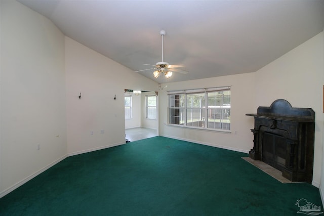 1701 Lighthouse Pointe Dr, Gulf Breeze, FL 32563 - unfurnished living room featuring vaulted ceiling, ceiling fan, a fireplace with flush hearth, carpet flooring, and baseboards