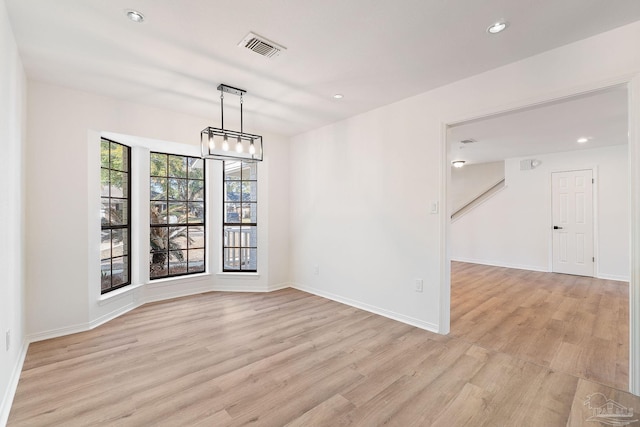 unfurnished dining area featuring recessed lighting, visible vents, light wood finished floors, and baseboards