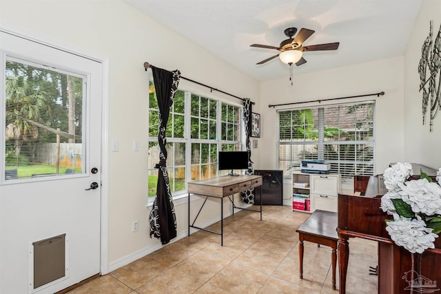 office area featuring light tile patterned flooring, a ceiling fan, and baseboards